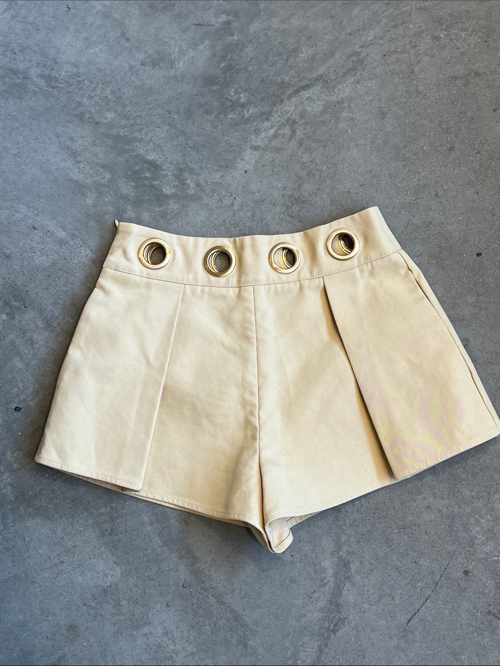 cult gaia Cream High-Waist Shorts with Gold Grommet Detail